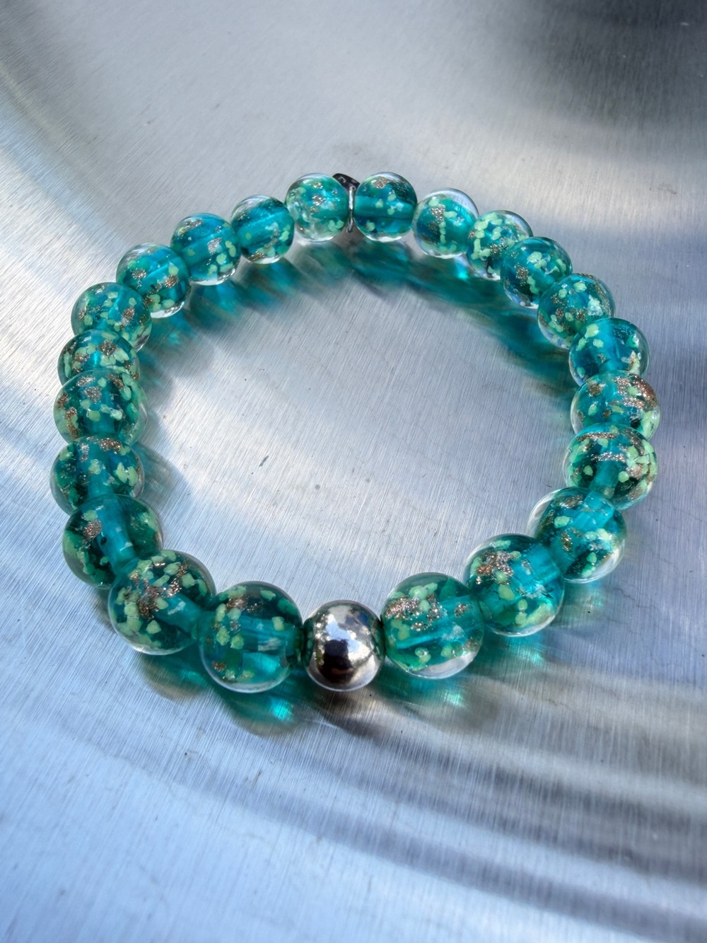 7” NOGU firefly glass and sterling silver bracelet in green